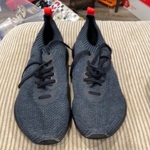 These are a pair of new balance runners size 13 black, red.